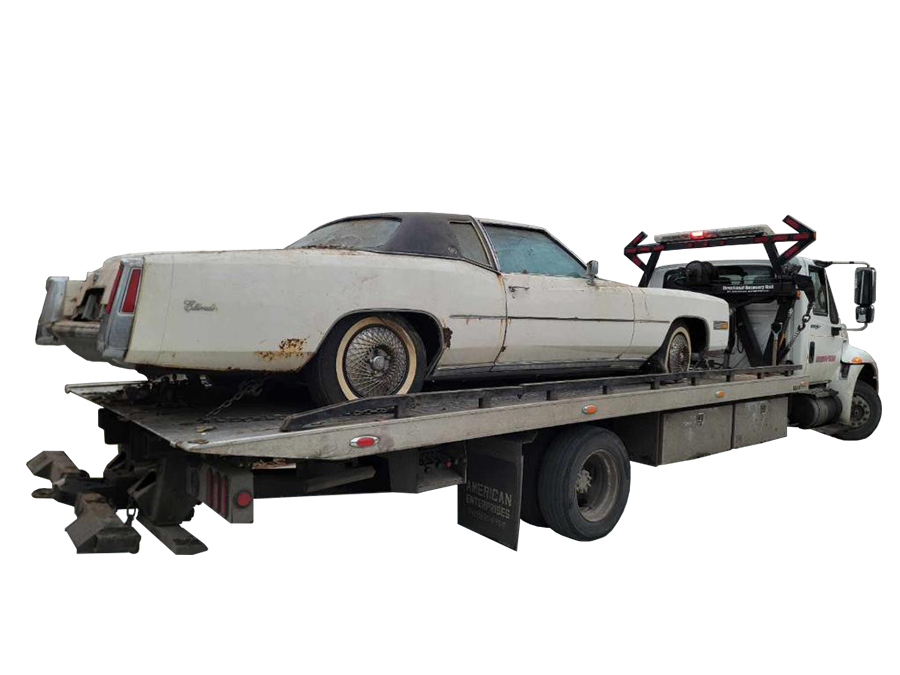 Old white car on tow truck